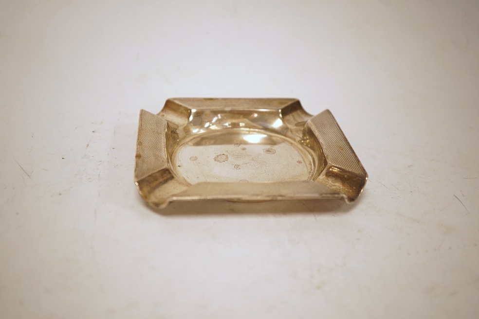 A heavy square engine-turned silver ashtray, by Mappin & Webb, Sheffield, 1964, 99mm, 6oz.